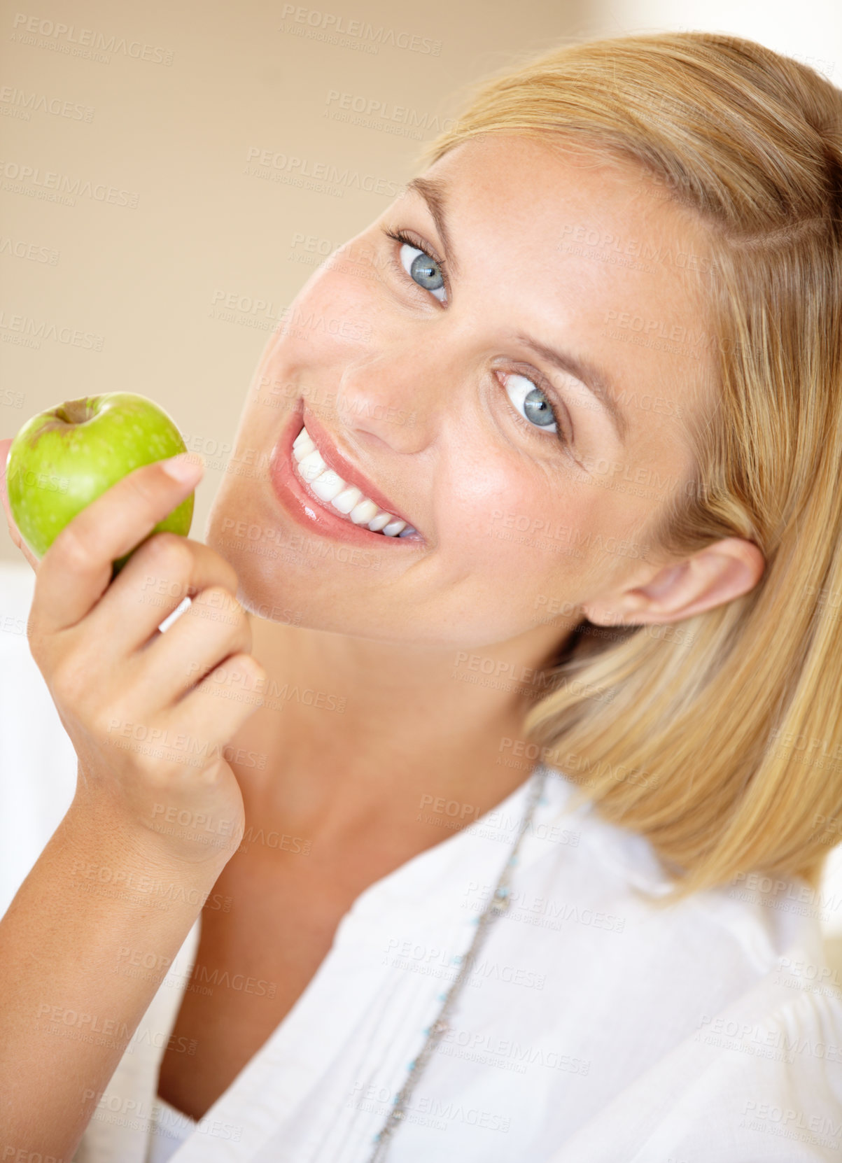 Buy stock photo Happy woman, holding and apple in portrait for health, nutrition or wellness. Female person, smile and fruit in hand for wellbeing, vitamin or fibre with choice for natural, fresh or organic diet