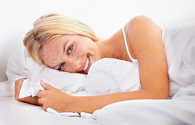 Buy stock photo Portrait of an attractive young woman lying in her bed