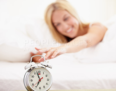 Buy stock photo Woman, stop and alarm clock for time in bedroom with noise, sound or alert for waking up. Happy person, smile and excited expression on face to press, switch and off for early morning, start and day 
