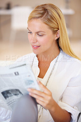 Buy stock photo Woman, holding and newspaper for reading in home for knowledge, information or news. Female entrepreneur, remote work or looking at article, page or headline for update on investment, stock or growth