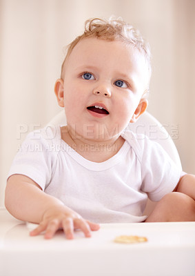 Buy stock photo A cute baby sitting in a baby chair