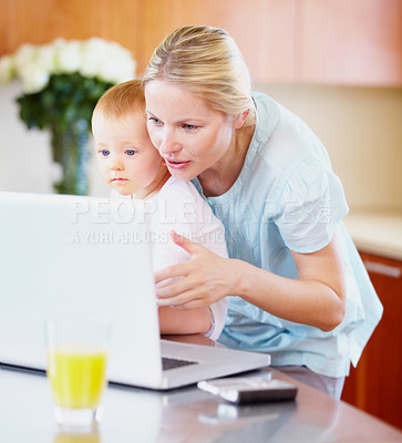 Buy stock photo Woman, baby and laptop for showing in home for learning, playing on streaming online. Mother, little boy or love in bond for growth, development or milestone with skills for technology in kitchen