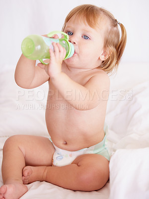 Buy stock photo A cute toddler drinking water from a bottle