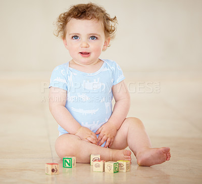 Buy stock photo Baby, boy and blocks for building, floor and smile with development, learning or playful in family home. Infant child, toys and education for progress, growth or childhood with sitting, room or house