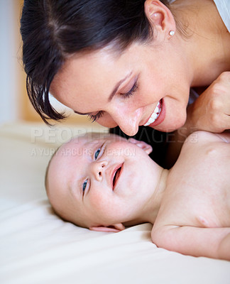 Buy stock photo Happy baby boy smiling as his mother leans down to close to him