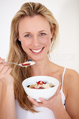 Buy stock photo A beautiful woman enjoying a bowl of fruit and yogurt