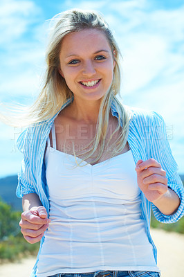 Buy stock photo Woman, portrait or smile outdoor with blue sky, freedom and casual fashion for travel or vacation. Person, face or tourist and happy in nature for adventure, holiday or location experience in summer