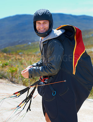 Buy stock photo Paragliding, parachute or man in nature in portrait, smile or strings for exercise for health support. Athlete, face and training with happy for outdoor fitness, helmet and equipment in countryside