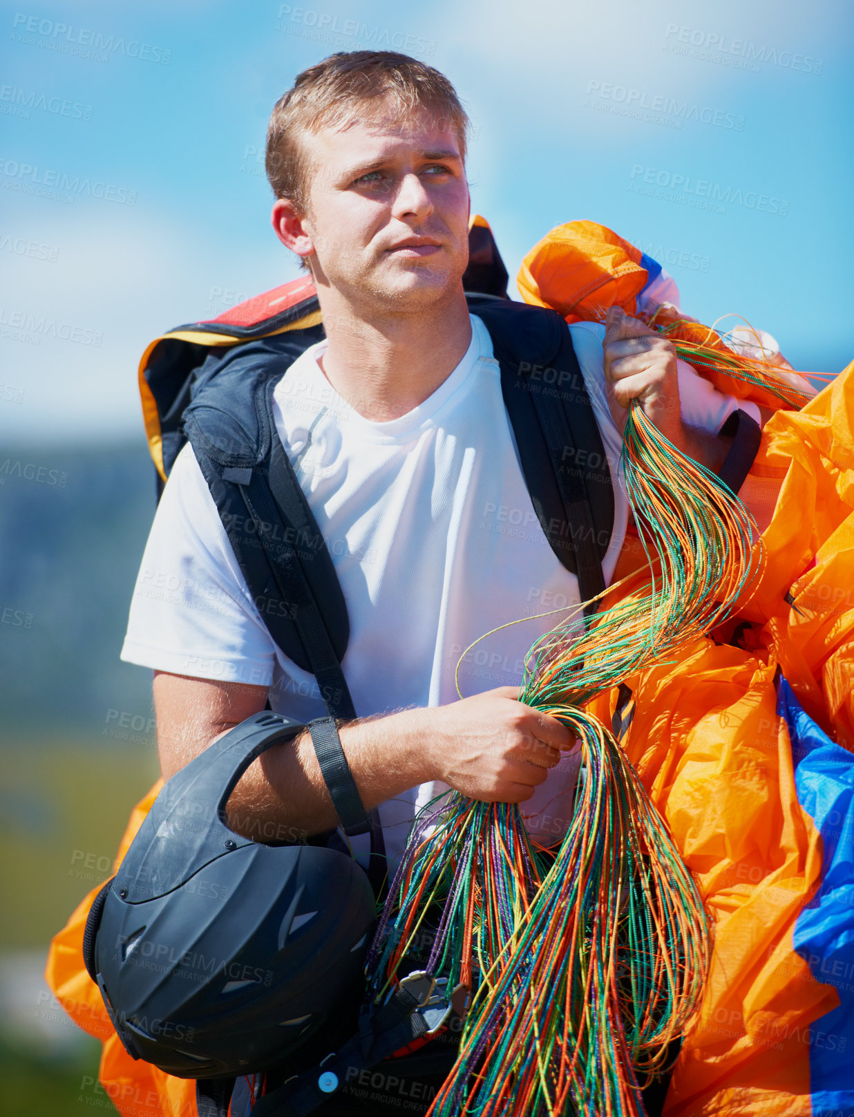 Buy stock photo Safety, parachute and man in nature for sport, equipment and strings for exercise for health support. Athlete, ready or training with fitness for outdoor wellness, helmet or harness in countryside