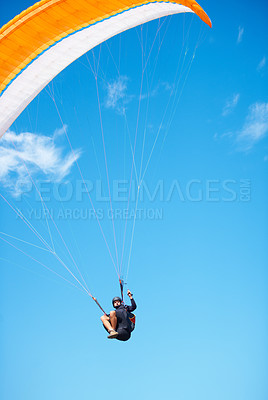 Buy stock photo Man, paragliding and blue sky adventure fun in clouds for explore city, outdoor courage or fearless athlete. Male person, parachute and mockup space or safety equipment for landing, flying in nature