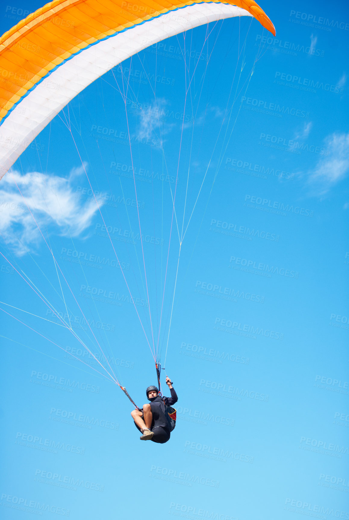 Buy stock photo Man, paragliding and blue sky adventure fun in clouds for explore city, outdoor courage or fearless athlete. Male person, parachute and mockup space or safety equipment for landing, flying in nature