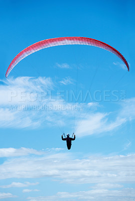 Buy stock photo Person, parachute and paragliding in blue sky in air, nature for exercise with healthy adventure for extreme sport. Athlete, flight or fearless by outdoor fitness for wellness, helmet or safety gear 