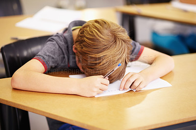 Buy stock photo Sleeping, bored and tired with boy in classroom for learning, education and knowledge. Stress, anxiety or confused with male student at desk in school adhd for exhausted, autism problem or frustrated