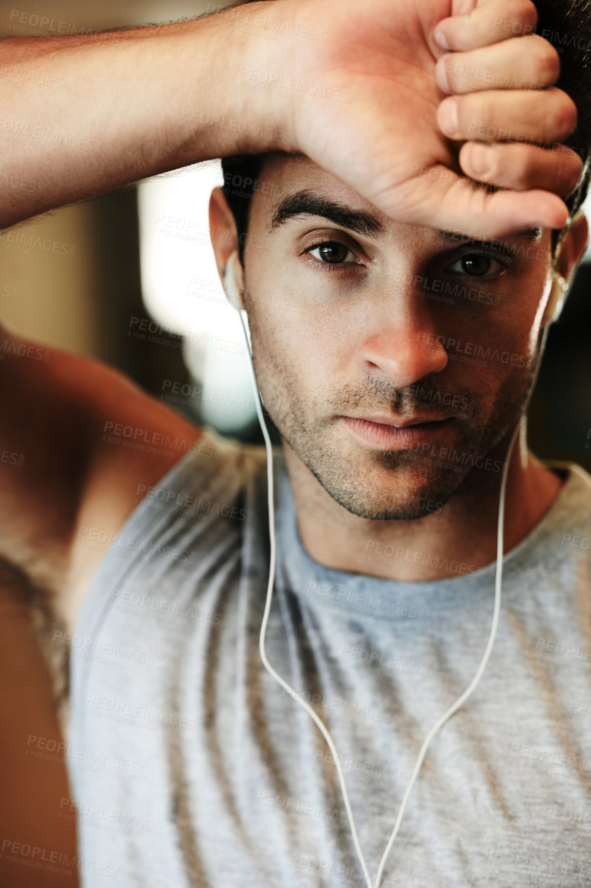Buy stock photo Man, earphones and music for fitness, portrait and workout at gym, streaming radio and podcast or audio. Male person, face and playlist for exercise, confident and train for wellness, cardio or ready