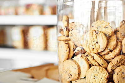 Buy stock photo Dessert, bakery and closeup of jar with cookies for coffee shop, sugar and junk food. Cooking, chocolate and nutrition with oatmeal biscuit in container in cafe for snack, breakfast and pastry