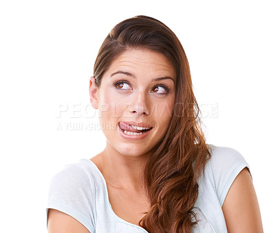 Buy stock photo A gorgeous young woman looking sideways while licking her lips
