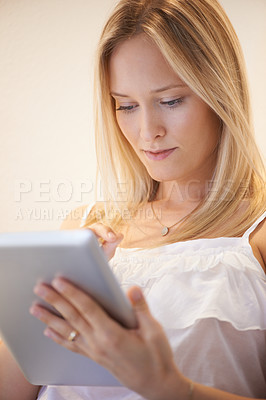 Buy stock photo Woman, tablet and research for online communication, networking or social media in living room at home. Female person or blonde in relax on technology for search, reading or ebook in lounge at house