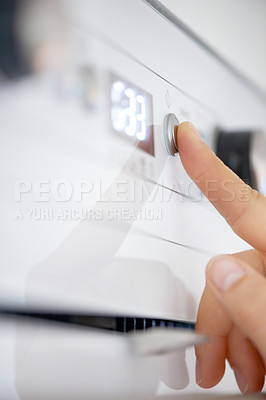 Buy stock photo Closeup, finger and button on oven in kitchen for heating, preparation and appliance for baking. Person, press or switch with number display for setting, temperature and timer in home for cooking