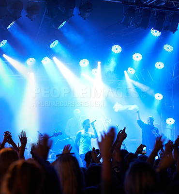 Buy stock photo Concert crowd, music festival singer and band audience listen to rock, metal or hip hop artist, rap star or live stage performance. Night show energy, excited party group and fans cheers for musician