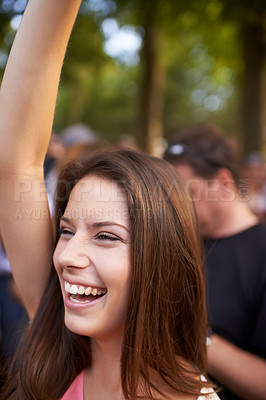 Buy stock photo Happy, music and festival with woman in crowd for celebration, party and energy. Dancer, new years concert and rock event with person dance in countryside for social, rave club and summer disco