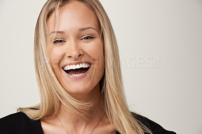 Buy stock photo A gorgeous young blonde woman smiling at the camera