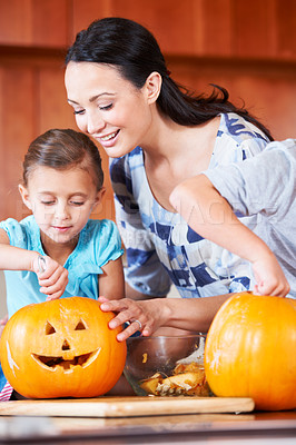Buy stock photo Halloween, pumpkin and mother with child in the kitchen for holiday celebration at home. Creative, smile and happy mom with girl kid bonding and carving vegetable for decoration or tradition at house