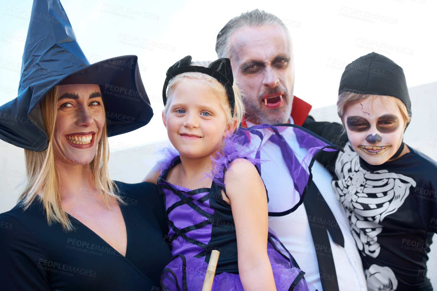 Buy stock photo A fun family dressed up for Hallowe'en, posing together