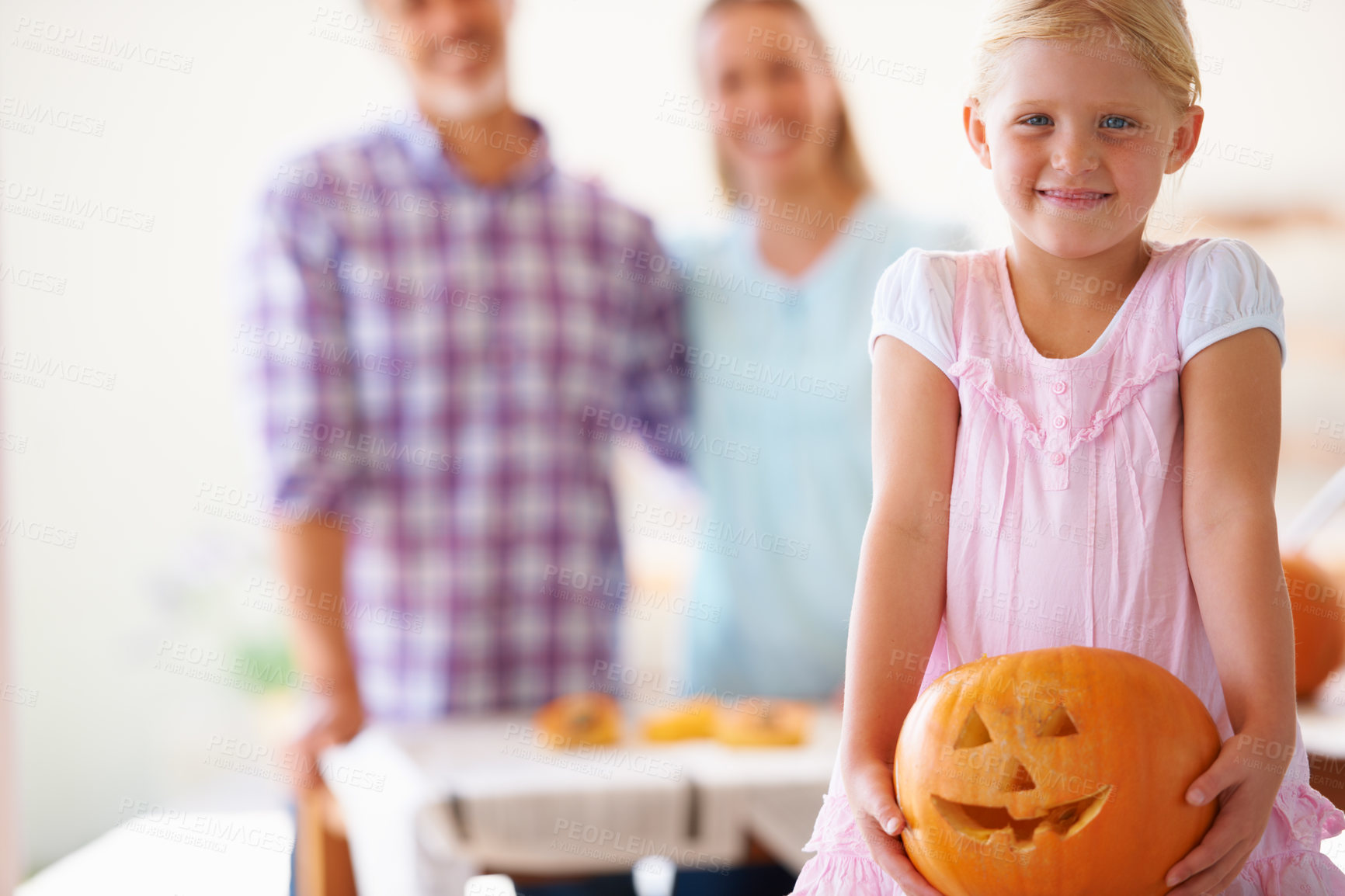 Buy stock photo Portrait, child and pumpkin for halloween celebration with parents for fun activity. Jack o lantern, family and little girl looking excited with vegetable and food for season tradition at home 