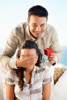 Buy stock photo Couple, ring box and boyfriend covering eyes for surprise, smile and happy for love, wife and engagement. Outdoor, secret and news for marriage, relationship and announcement with excitement
