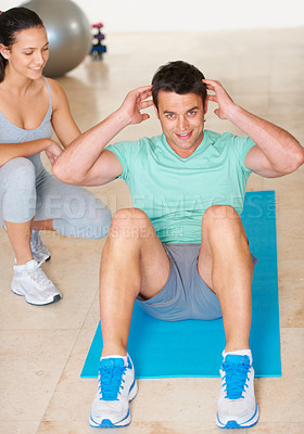 Buy stock photo Personal trainer, fitness and portrait of man sit up in exercise and workout for health, wellness and cardio, People, training or coach helping person with core, crunches and pilates routine in gym