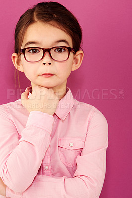 Buy stock photo Girl child in portrait, glasses and thinking with questioning expression, smart and vision isolated on pink background. Intelligent, geek or nerd with female kid in studio, thoughtful in eyewear