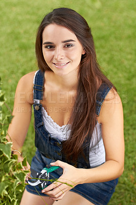 Buy stock photo Young woman in garden, trimming leaves and gardening, nature and smile in portrait with Spring time and blossom. Botany, planting and female gardener is backyard, outdoor landscaping and happy youth