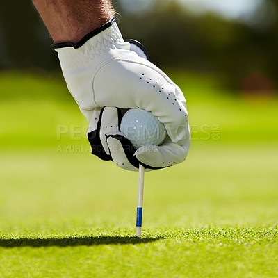 Buy stock photo Ball, tee and hands of man on golf course for contest, competition challenge and target training. Closeup, grass lawn and golfer gloves with pin in ground for action, games and sports gear on field