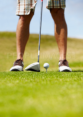 Buy stock photo Cropped image of a golfer about to smack the golfball down the fairway