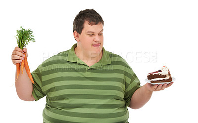 Buy stock photo Plus size, hungry decision and man with carrot and dessert choice thinking about food. Male model, studio and white background with healthy and cake order with weight loss and nutrition balance idea