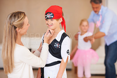Buy stock photo Son, pirate costume and halloween with mother in home, face paint and happiness in childhood. Boy, smile and house birthday with party clothes by woman, love family and celebration together with care
