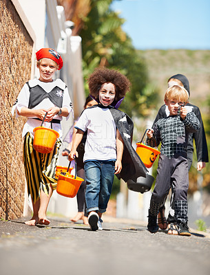 Buy stock photo Halloween, children or trick and treat portrait outdoor in neighborhood for fun and dress up. A group of young kids together for happiness, celebrate holiday and diversity with candy or sweets