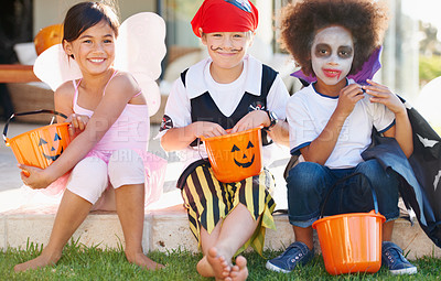Buy stock photo Children, halloween and candy bucket for costume fun or dracula dress up, fairy or pirate role play. Friends, group and pumpkin basket as dessert or trick or treat celebration, fantasy or development