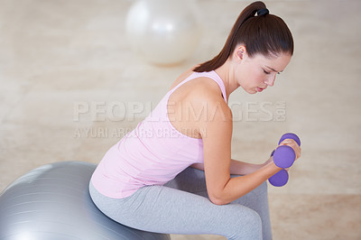 Buy stock photo Dumbbells, woman and fitness with workout, exercise and wellness studio with gym equipment, health and energy ball. Person, challenge and girl with sports, progress and endurance with training
