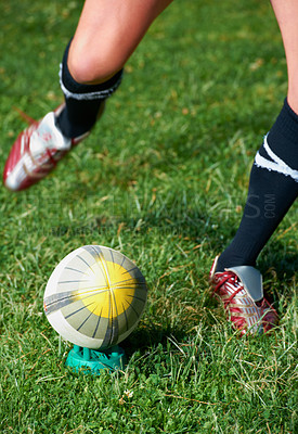 Buy stock photo Rugby kick, feet and man with a sports ball outdoor on a pitch for action, goal or score. Male athlete person playing in sport competition, game or start training for fitness, workout or exercise