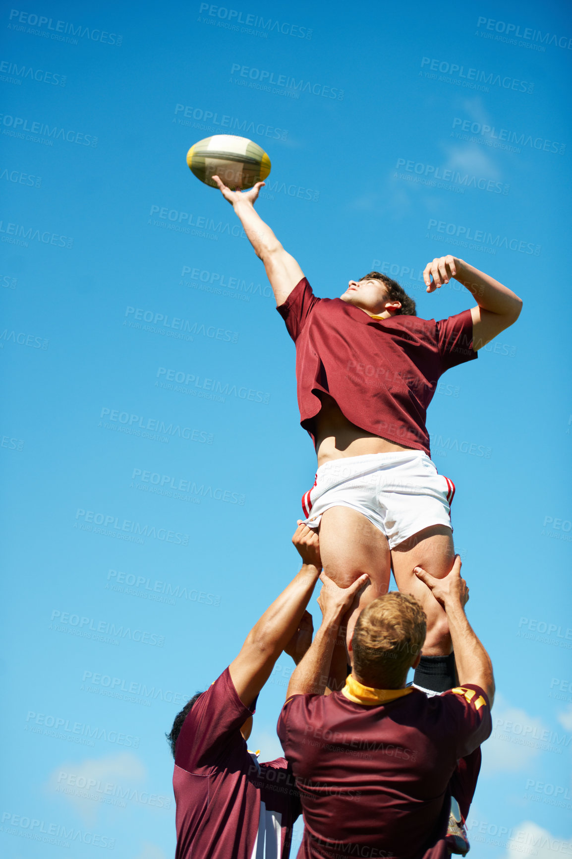 Buy stock photo Shot of a young rugby player catching the ball during a lineout
