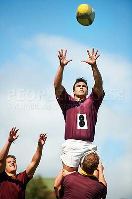 Buy stock photo Sports, rugby player catch and with ball on field of grass. Teamwork or collaboration, professional athlete and strong athletic men or fitness people together as a team in sportswear or gear
