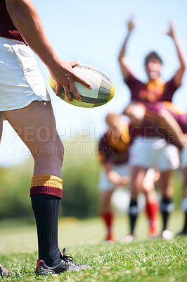 Buy stock photo Rugby, closeup and man with a ball in hand outdoor on a pitch for teamwork, target and score. Male athlete team playing in sports competition, game or training match for fitness, workout or exercise