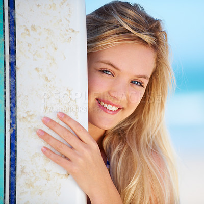 Buy stock photo Portrait of a pretty blonde with her surfboard on the beach