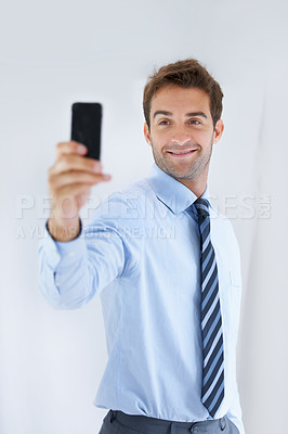 Buy stock photo Happy businessman, selfie and social media for photography, memory or online vlog at office. Handsome or attractive man or employee smile for photograph, picture or business fashion at workplace