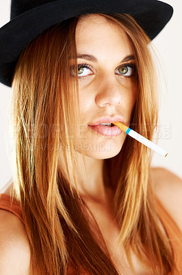 Buy stock photo Fashion, portrait and woman smoking in studio with style, attitude or edgy aesthetic. Cigarette, face and young female smoker with cool, confidence and trendy outfit with bad habit or addiction