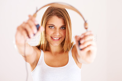 Buy stock photo Portrait, hands and happy woman with headphones in studio for listening, invitation or deal on white background. Music, offer and face of female model with subscription, streaming or radio earphones 