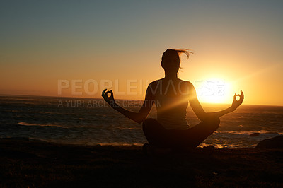 Buy stock photo Silhouette of a woman doing a yoga pose against a setting sun