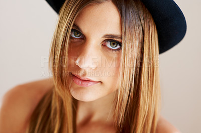 Buy stock photo Serious, hipster and portrait of woman with vintage hat, fashion or confidence in white background or studio. Retro, style and face of person in old fashioned fedora with makeup, cosmetics and beauty