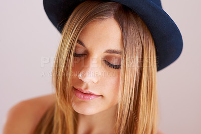 Buy stock photo Woman, eyes closed and hat for fashion in studio with mock up for style on white background. Swedish model, hairstyle and confidence by satisfaction on face with vintage, clothes and fedora in space